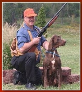 Dr. Bill Howard with his dog outdoors